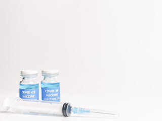 Selective focus COVID 19 VACCINE with syringe isolated on white background. 