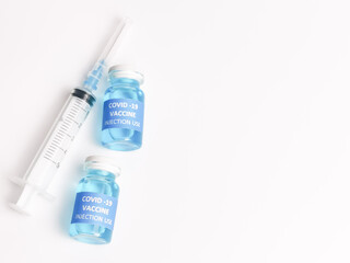 Selective focus COVID 19 VACCINE with syringe isolated on white background.  
