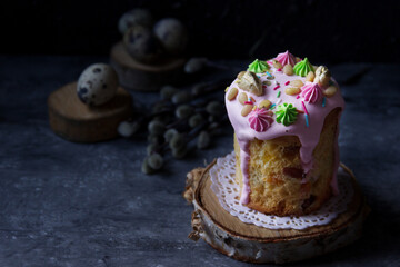 This Easter cake is  decorated with meringues and nuts on a dark background.