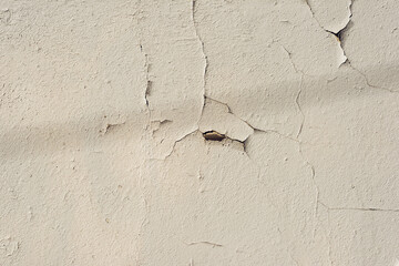 A wall with peeling plaster