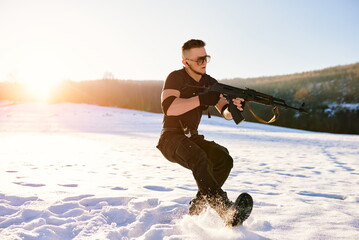 soldier with weapons in forest somewhere above the Arctic Circle