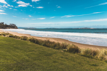Bllackmans Bay beach in southern Hobart in Tasmania, Australia on a very windy day with intense swell and waves and no people
