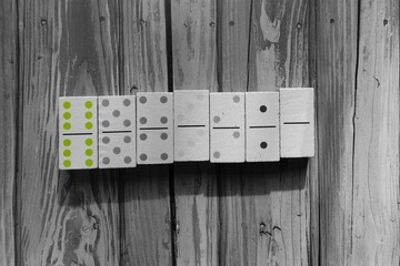 A row of Domino
es, face-up, from double sixes to double zero. 