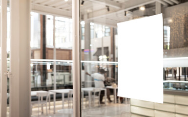 Mockup white paper or white promotion poster displayed on the front of the restaurant, coffee shop...