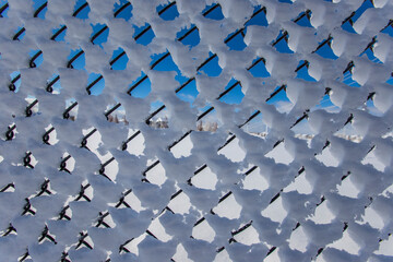 Fototapeta premium snow on the fence texture background
