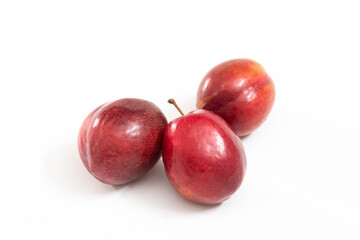 red plums isolated on white background

