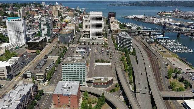 Cinematic drone footage of the Greater Tacoma Marriott Convention Center,  downtown Tacoma, waterfront, Thea Foss waterway, Commencement Bay near Seattle, in the Pacific Northwest, Pierce County