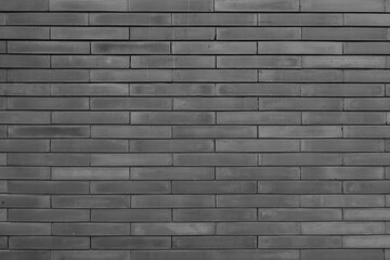 simple black brick wall pattern for industrial and minimalism wallpaper and background design