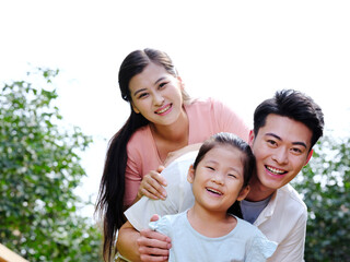 Happy family of three in the outdoor group photo