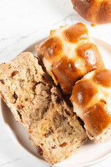 Fresh baked traditional Easter hot cross buns with raisins.