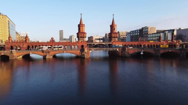 Beautiful Oberbaum Bridge over River Spree in Berlin from above - aerial view. Amazing drone footage