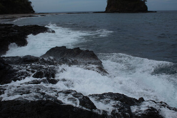 waves crashing on rocks
