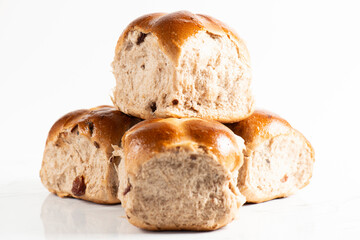 Fresh baked traditional Easter hot cross buns with raisins.