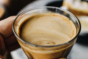 Close up of a hot cup of coffee in the concept of relaxing and break time.