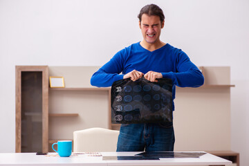 Young sick man suffering at home