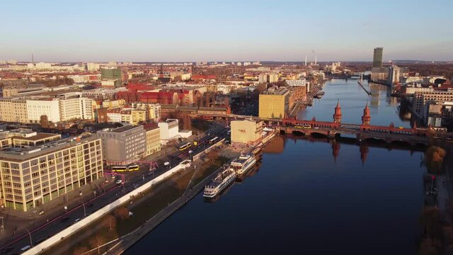Amazing Oberbaum Bridge in Berlin at sunset - aerial view. Amazing drone footage