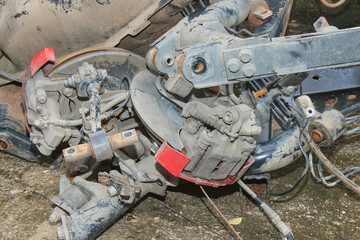 Old Wheel Hub and Brake Caliper and Fuel Tank on Ground. Old Car Part or Auto Part in Car Repair Shop