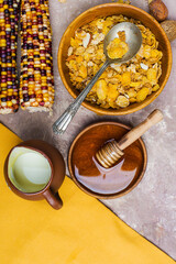cornflakes with milk and honey top view