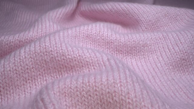 Cozy angora wool pink fabric texture in macro. Handcraft knitting woolen sweater. Soft textile abstract background. Winter fashion clothing industry. Home comfort and cosiness