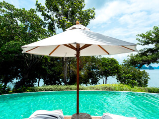 White outdoor canvas beach umbrella.