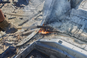 Right View of Car Mechanic or Auto Mechanic Cut Car Frame or Body by Oxygen Acetylene Cutting Technique