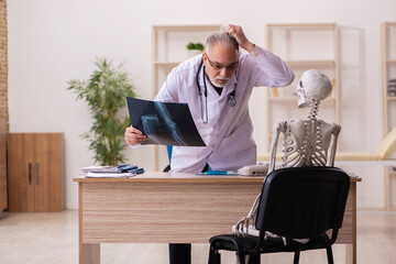 Dead patient visiting old male doctor radiologist