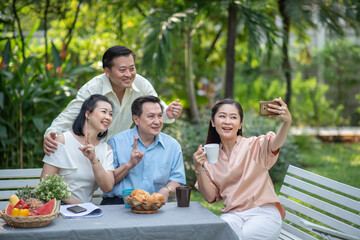 Group of asia family and friends happiness meeting, Lifestyle people middle age outdoor party. Communication social online life of asian people.