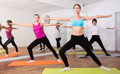 Fototapeta na wymiar Women doing stretching exercises for yoga in the room. High quality photo
