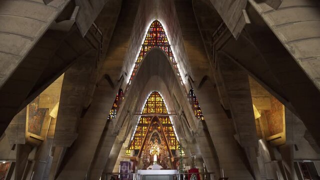 Sunlight in a Christian temple. Pews for the parishioners of the Dominican Cathedral Basilica of Nuestra Se&ntilde;ora de la Altagracia. Modern architecture and ancient scripture.