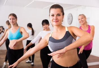 Fototapeta premium Fitness women practicing zumba movements. High quality photo