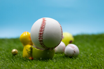 Baseball for Easter Holiday with Easter eggs on green grass