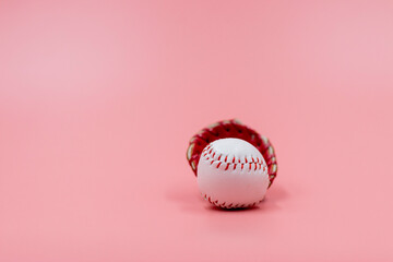 Baseball is on pink background