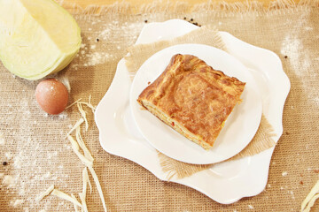 Chicken and potato pie on the dining table. The food is ready to eat. Puff pastry. kitchen utensils for cooking