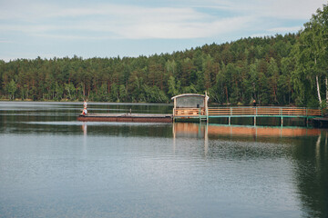 fishing bridge by the river. docks for boats on the lake. water and transport