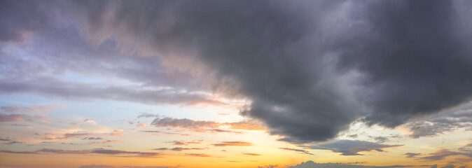 Naklejka na ściany i meble Natural background: dramatic stormy sky at sunset
