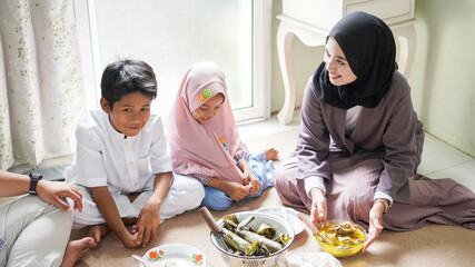 The family tradition of Eid al-Fitr is to eat ketupat opor or side dishes