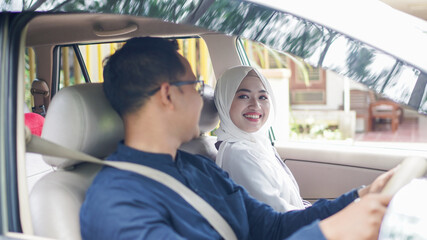 Muslim family in the car will go home to celebrate Eid