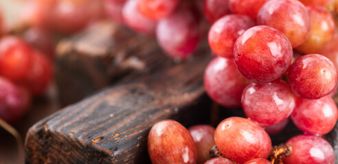 Fresh red grapes close up. Copy space
