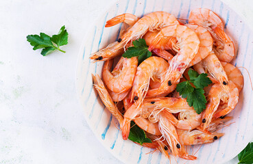Prawns on bowl. Shrimps, prawns. Whole boiled shrimp. Seafood. Top view, flat lay, copy space