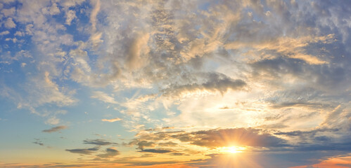 Naklejka na ściany i meble Panorama of dramatic colorful sky at sunset