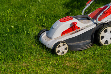 lawn mower on green grass