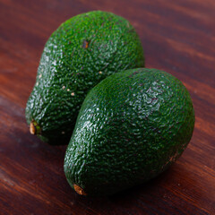 Image of ripe avocado at table, healthy food, nobody