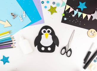 Step-by-step instruction of making a penguin out of paper with children. Step 5 © nadezhda
