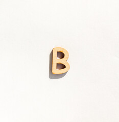 wooden classic letter b isolated on a white background, english alphabet from natural materials for children, eco friendly concept