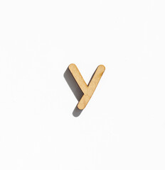 wooden letter y isolated on a white background, english alphabet from natural materials for children, eco friendly concept