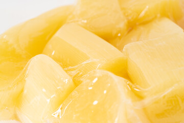 Fresh sugar cane chunks on pure white background