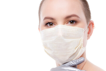 Beauty portrait of a short-haired woman in mask and gloves