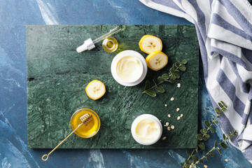 Composition with banana cosmetics on color background