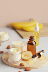 Composition with banana cosmetics on table