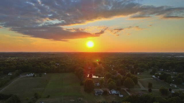 View of scenic small american countryside village on dramatic sunset over fields landscape on Akron Ohio USA